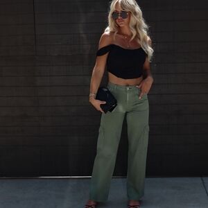Trendy Black Off-Shoulder Top with Green Cargo Pants